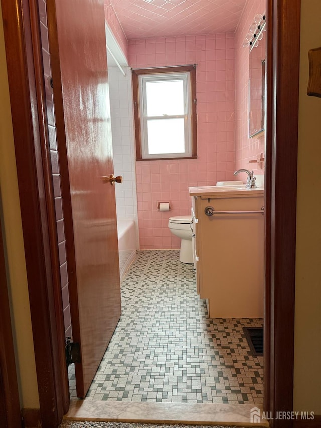 13 Olchaskey Ave, South River, NJ 08882 - full bath with tile walls, vanity, a bath, and tile patterned floors