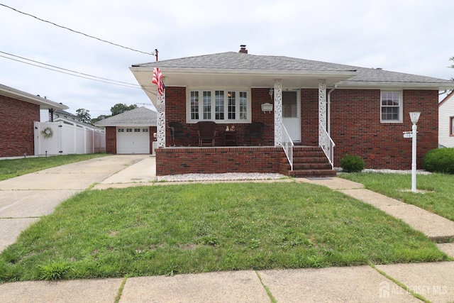 13 Olchaskey Ave, South River, NJ 08882 - view of front of house featuring concrete driveway, brick siding, a chimney, and covered porch