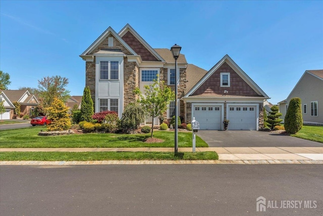 1 Ballybunion Dr, Monroe, NJ 08831 - view of front facade featuring stone siding, a front lawn, and asphalt driveway