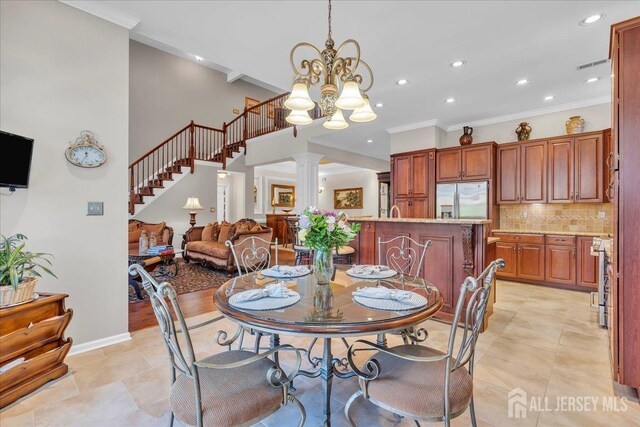 1 Ballybunion Dr, Monroe, NJ 08831 - dining space featuring recessed lighting, ornate columns, ornamental molding, a chandelier, and light tile patterned flooring