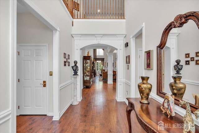 1 Ballybunion Dr, Monroe, NJ 08831 - foyer with decorative columns, arched walkways, a high ceiling, and wood-type flooring