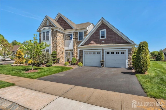 1 Ballybunion Dr, Monroe, NJ 08831 - craftsman house featuring stone siding, driveway, a garage, and a front lawn