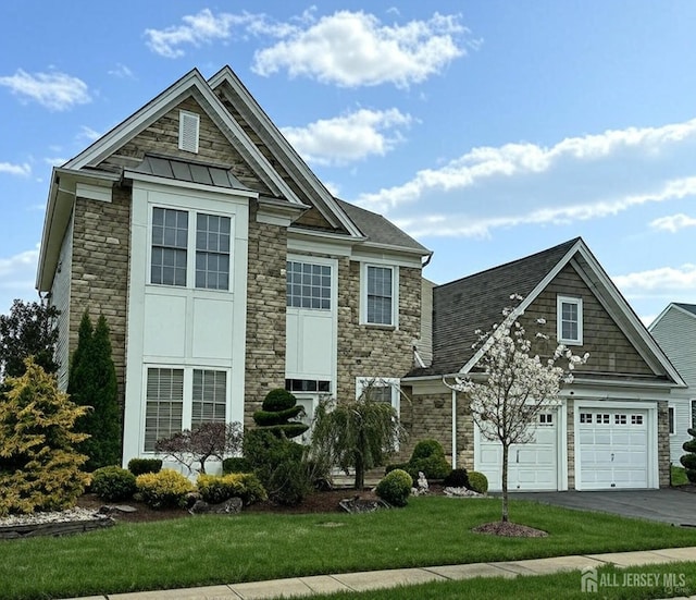 1 Ballybunion Dr, Monroe, NJ 08831 - view of front facade with stone siding, driveway, a front yard, a garage, and a standing seam roof