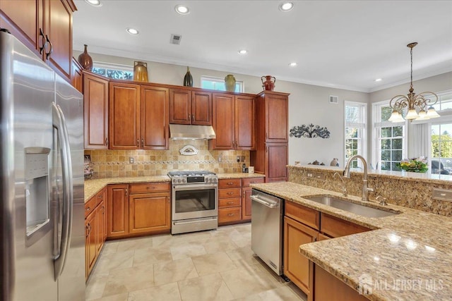 1 Ballybunion Dr, Monroe, NJ 08831 - kitchen featuring appliances with stainless steel finishes, a sink, under cabinet range hood, crown molding, and backsplash