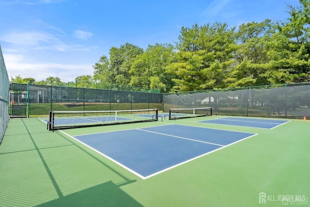view of sport court with fence and community basketball court