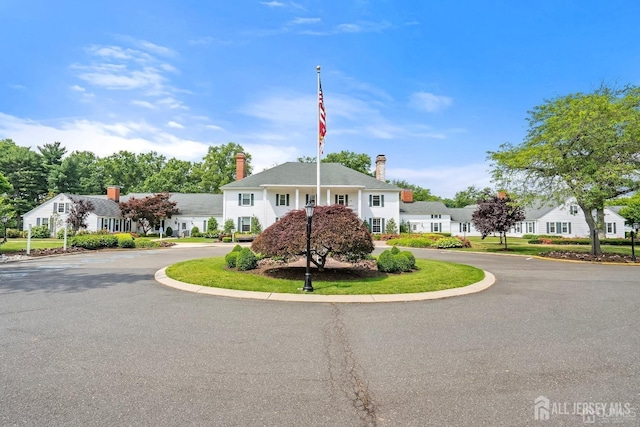458 Revere Way Unit A, Monroe, NJ 08831 - view of front of home with a chimney, a residential view, and curved driveway