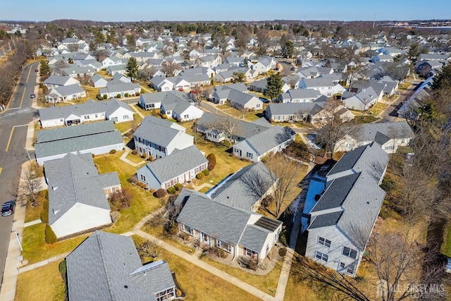 birds eye view of property with a residential view