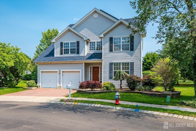 37 Muirfield Blvd, Monroe, NJ 08831 - traditional-style house with a front lawn, decorative driveway, and a garage