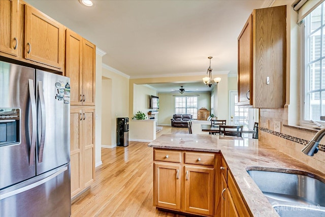 37 Muirfield Blvd, Monroe, NJ 08831 - kitchen featuring stainless steel refrigerator with ice dispenser, crown molding, a peninsula, open floor plan, and a ceiling fan