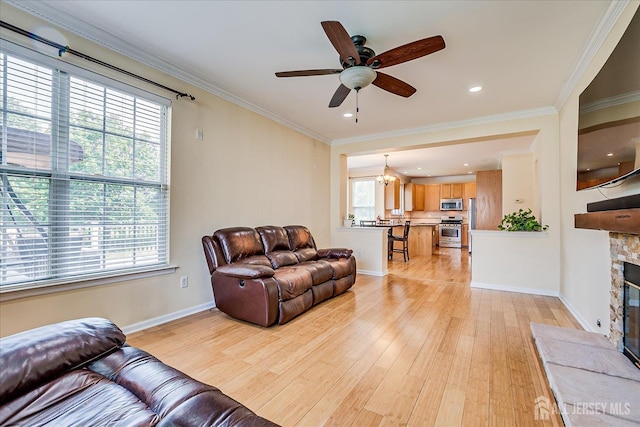 37 Muirfield Blvd, Monroe, NJ 08831 - living area with light wood-type flooring, a ceiling fan, a stone fireplace, crown molding, and recessed lighting