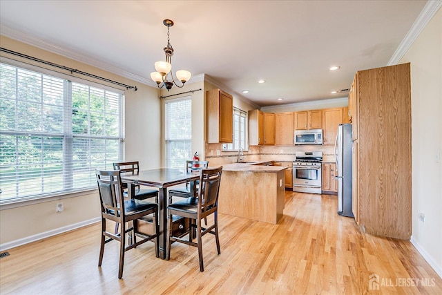 37 Muirfield Blvd, Monroe, NJ 08831 - dining space with ornamental molding, plenty of natural light, a chandelier, light wood-style floors, and recessed lighting