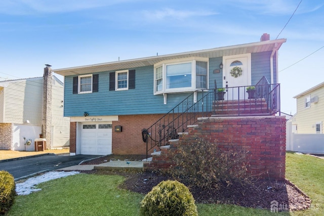 view of front of property with aphalt driveway, central AC, a garage, brick siding, and a chimney