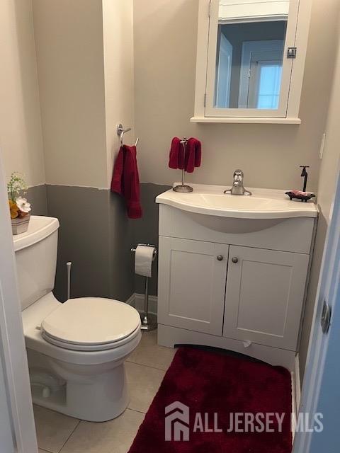79 Davidson Mill Rd, South Brunswick, NJ 08902 - bathroom featuring tile patterned flooring, toilet, and vanity