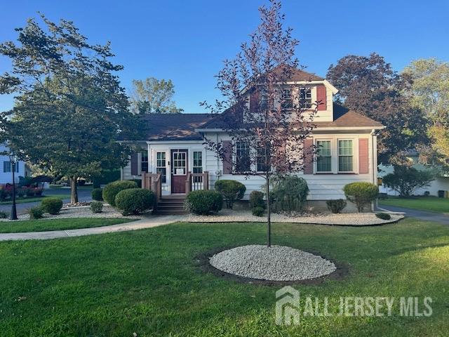 79 Davidson Mill Rd, South Brunswick, NJ 08902 - view of front facade with a front lawn