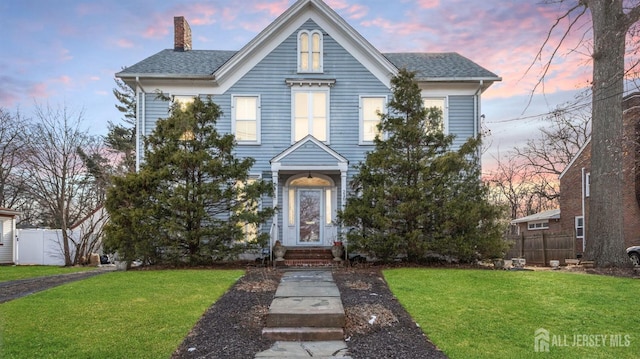 view of front of property with a yard