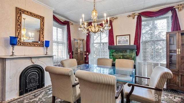 dining area with crown molding and an inviting chandelier