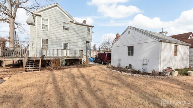 back of property with a deck