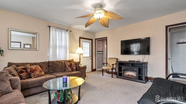 living room with ceiling fan and light carpet