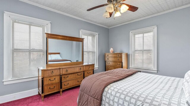 bedroom with ceiling fan, crown molding, and carpet flooring