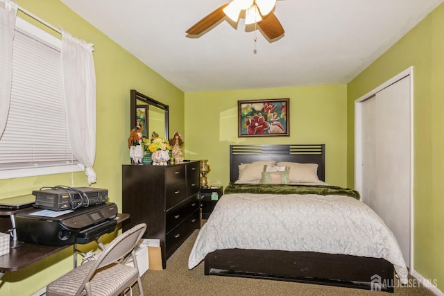 bedroom with carpet flooring, ceiling fan, and a closet