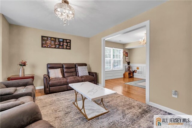 161 Metuchen Ave, Woodbridge Proper, NJ 07095 - living room featuring a chandelier and wood finished floors