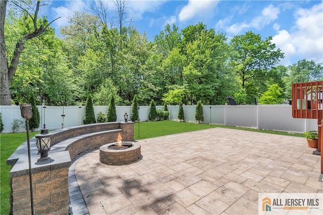 view of patio / terrace featuring a fire pit