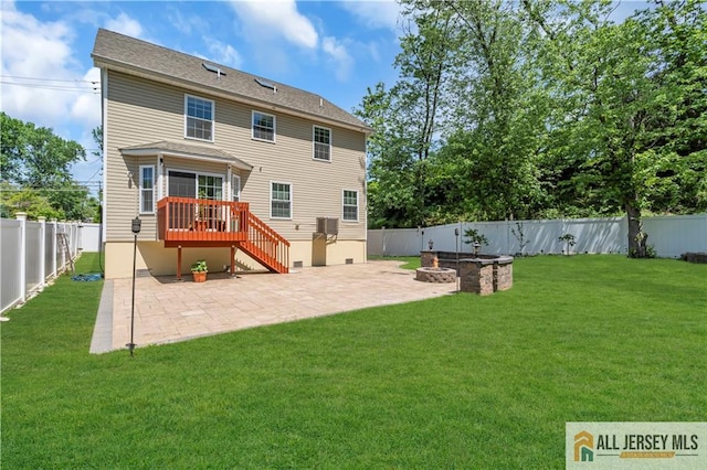 back of property featuring a patio, a wooden deck, stairs, and a fire pit