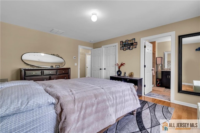 bedroom with light wood-type flooring