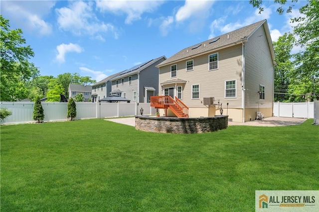 rear view of house with stairway, a patio area, a wooden deck, and a residential view