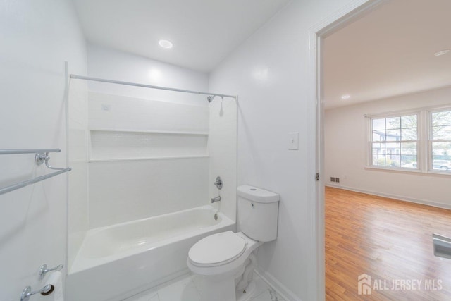 full bathroom with toilet, baseboards, shower / bathtub combination, and wood finished floors