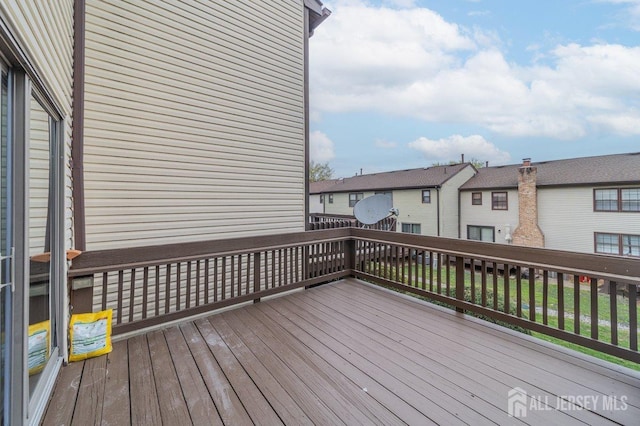 wooden terrace with a residential view