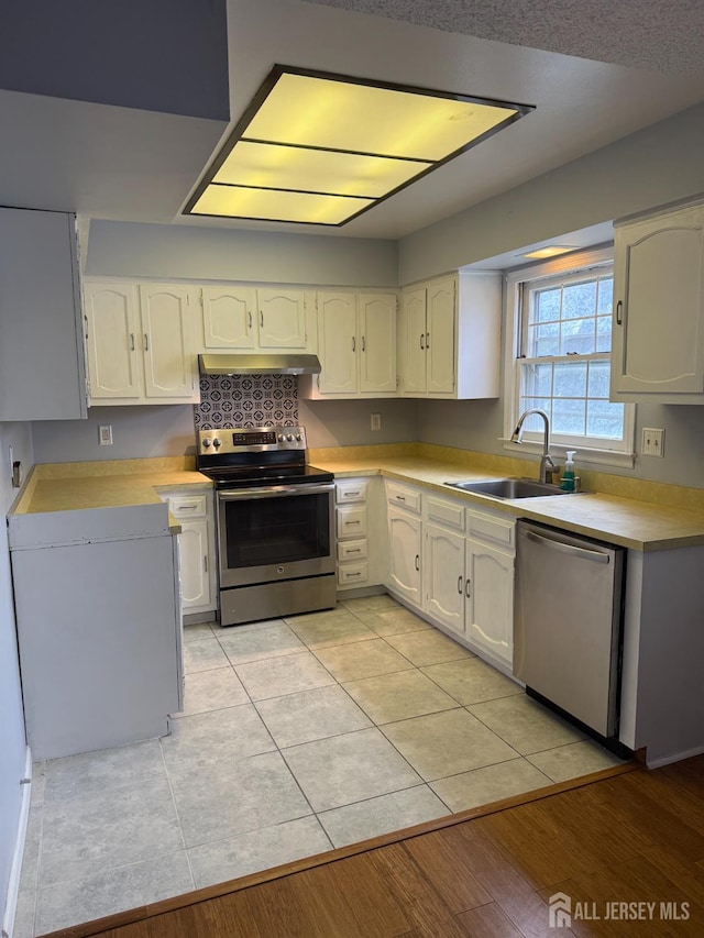 469-O New Haven Way, Monroe, NJ 08831 - kitchen with appliances with stainless steel finishes, a sink, white cabinetry, and light countertops