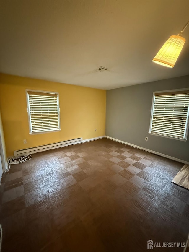 469-O New Haven Way, Monroe, NJ 08831 - empty room with a baseboard heating unit, baseboards, healthy amount of natural light, and tile patterned floors