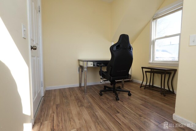 office with dark hardwood / wood-style flooring