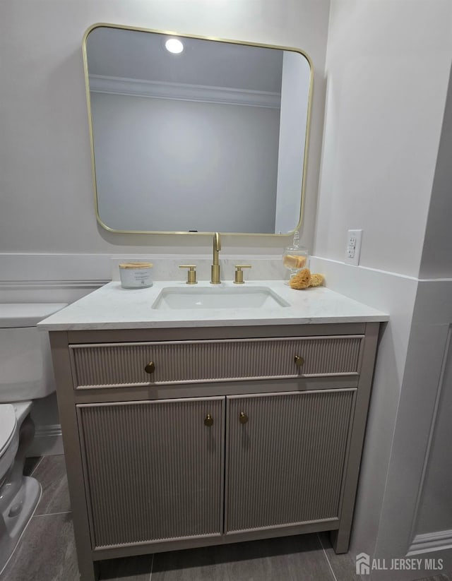 bathroom with vanity and toilet