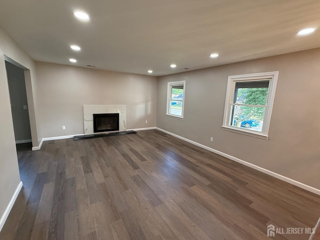 179 Buckelew Ave Unit A, Jamesburg, NJ 08831 - unfurnished living room featuring recessed lighting, dark wood-style flooring, and a premium fireplace