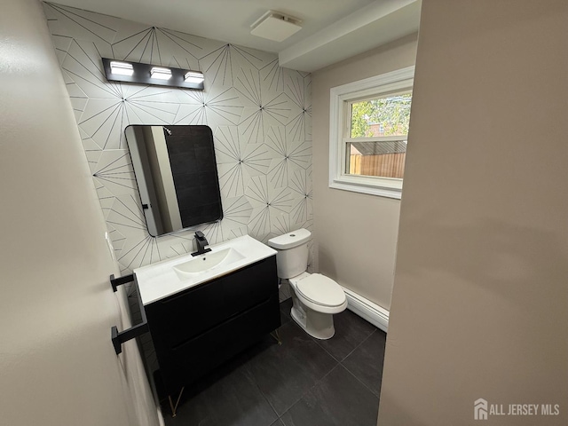 179 Buckelew Ave Unit A, Jamesburg, NJ 08831 - bathroom featuring a baseboard heating unit, vanity, tile walls, and tile patterned floors