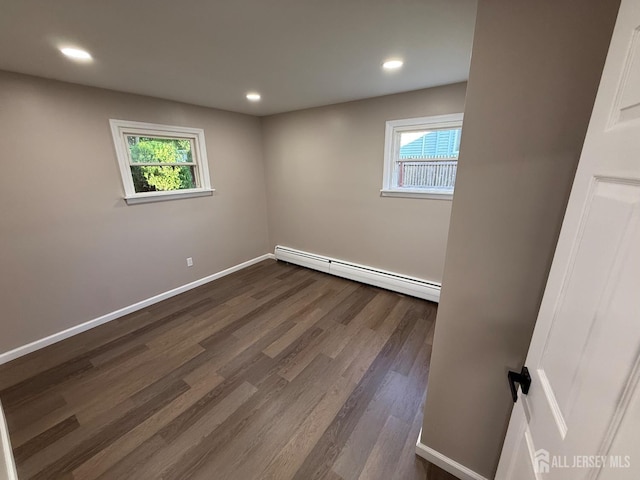179 Buckelew Ave Unit A, Jamesburg, NJ 08831 - spare room with baseboard heating, plenty of natural light, dark wood-type flooring, and recessed lighting