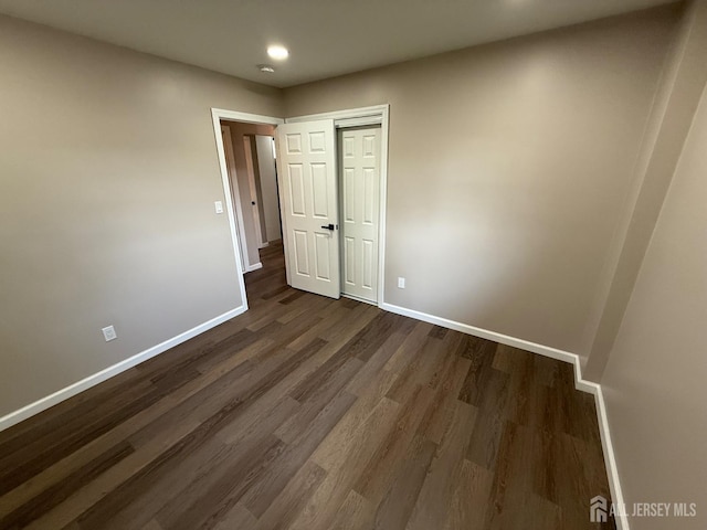 179 Buckelew Ave Unit A, Jamesburg, NJ 08831 - unfurnished bedroom with dark wood-type flooring, a closet, and recessed lighting
