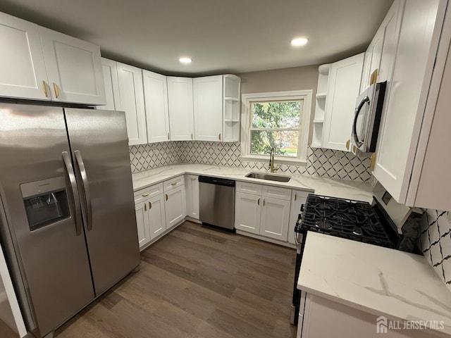 179 Buckelew Ave Unit A, Jamesburg, NJ 08831 - kitchen featuring stainless steel appliances, open shelves, light stone countertops, dark wood-style floors, and backsplash