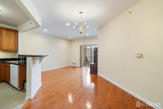 540 Cranbury Rd Unit 407, East Brunswick, NJ 08816 - kitchen with visible vents, white dishwasher, dark countertops, a sink, and recessed lighting