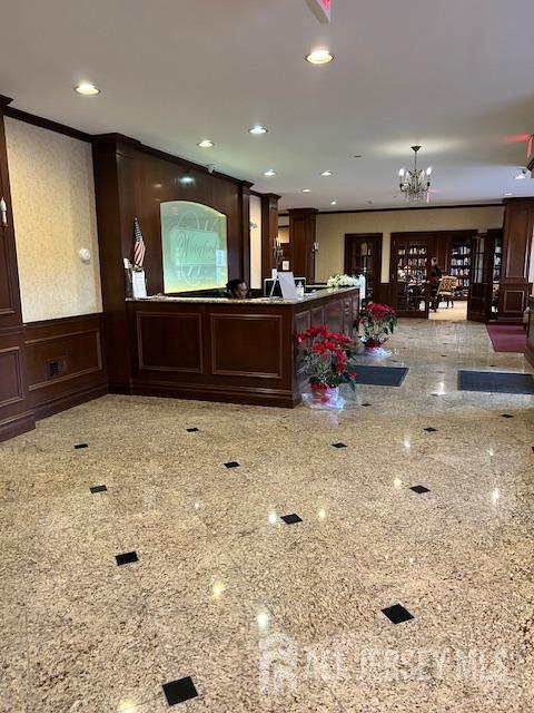 reception area featuring a chandelier