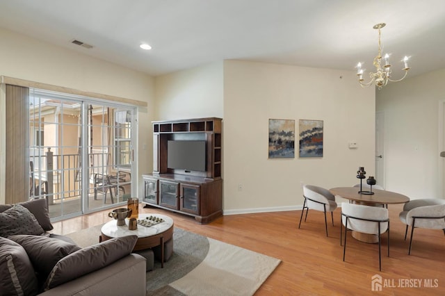 540 Cranbury Rd Unit 407, East Brunswick, NJ 08816 - living area featuring an inviting chandelier, visible vents, wood finished floors, baseboards, and recessed lighting