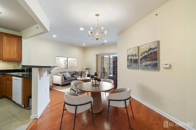 540 Cranbury Rd Unit 407, East Brunswick, NJ 08816 - dining room featuring recessed lighting, baseboards, a notable chandelier, and light wood finished floors