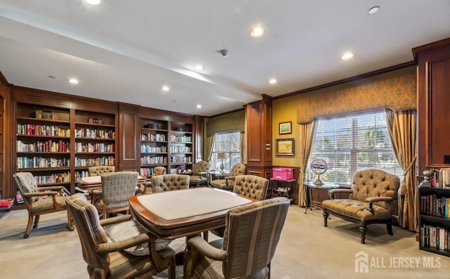 dining space with crown molding, recessed lighting, and light carpet