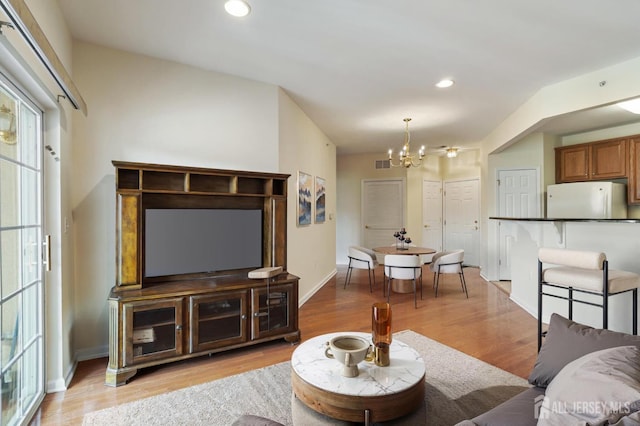 540 Cranbury Rd Unit 407, East Brunswick, NJ 08816 - living room featuring visible vents, recessed lighting, light wood-style flooring, and a chandelier