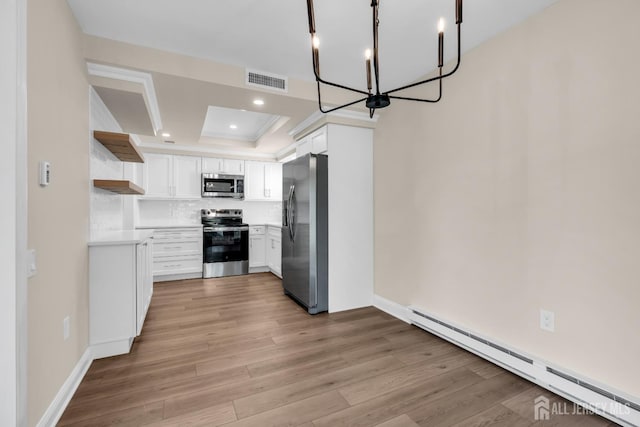 377-B Old Nassau Rd, Monroe, NJ 08831 - kitchen featuring appliances with stainless steel finishes, a baseboard radiator, open shelves, light wood-style flooring, and a chandelier