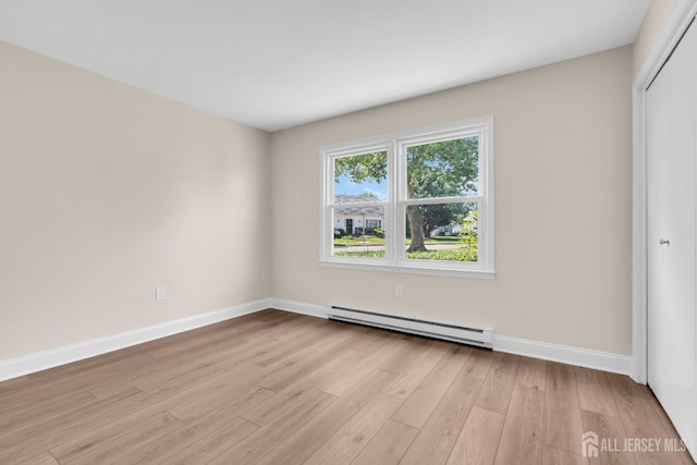377-B Old Nassau Rd, Monroe, NJ 08831 - spare room with a baseboard heating unit and light wood-style floors