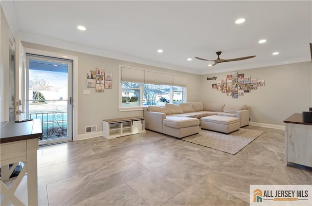 living room featuring crown molding and ceiling fan