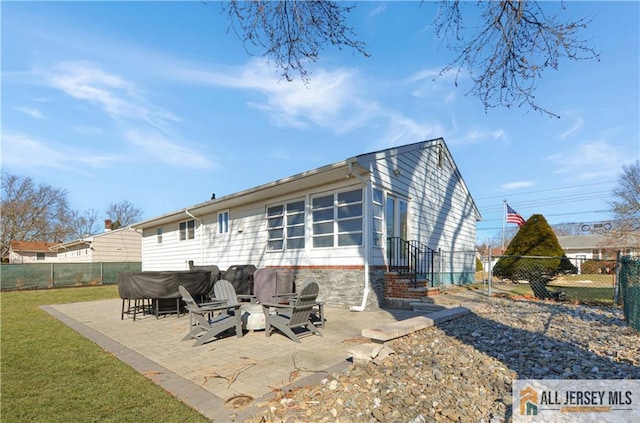 rear view of property featuring a patio